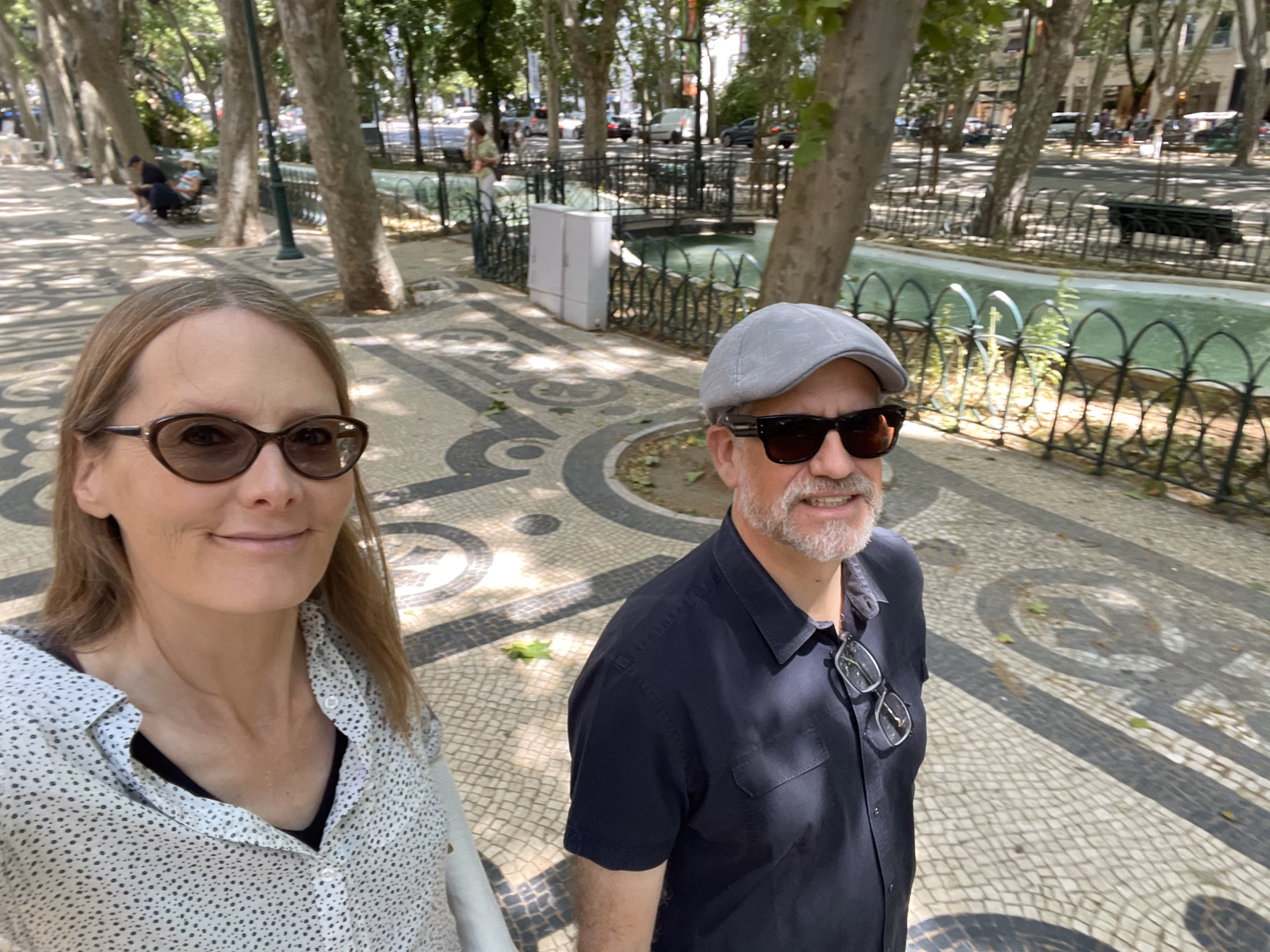 tracey & hunter walking tiled streets of Lisbon