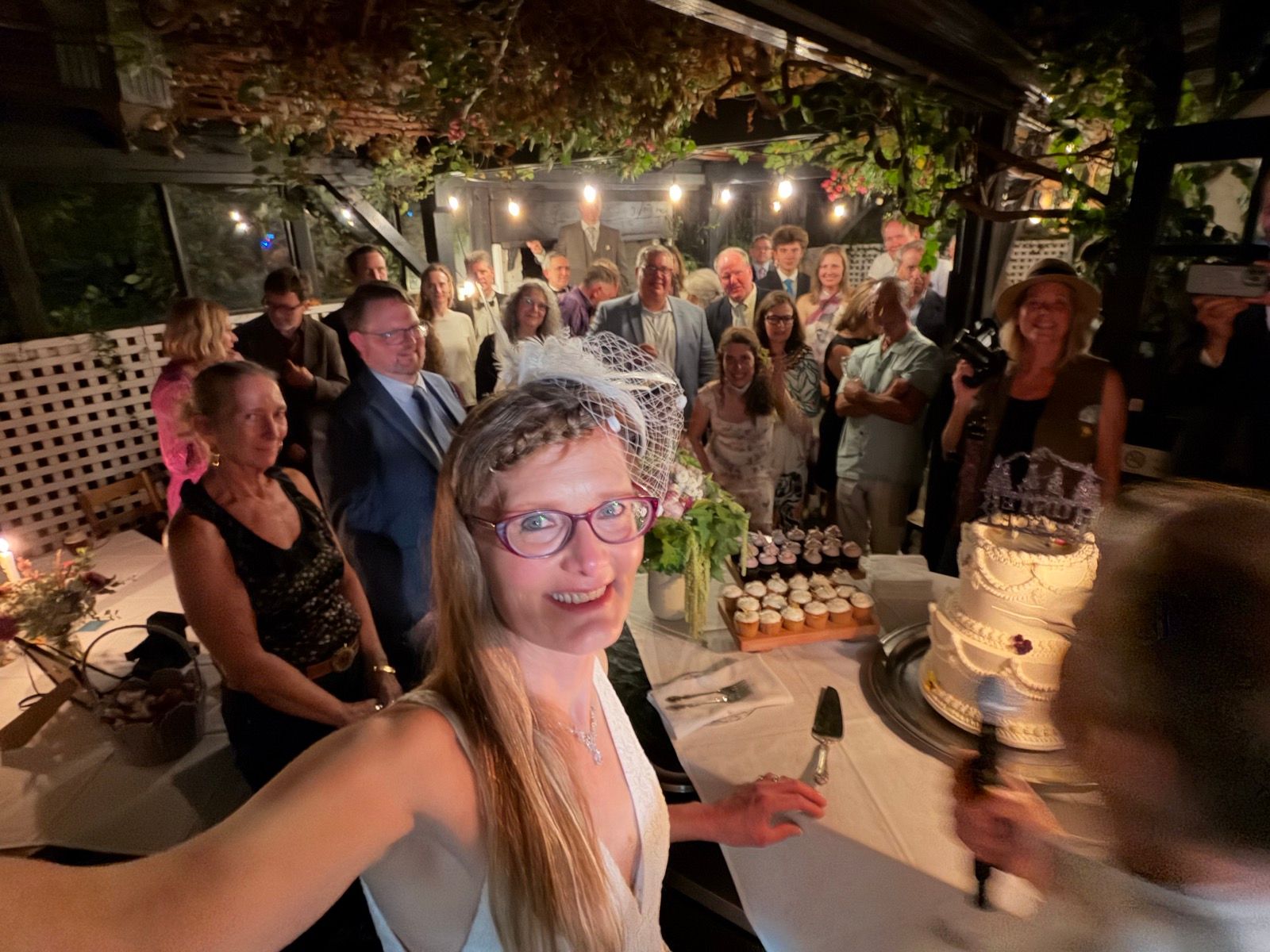 bride with cake and guests