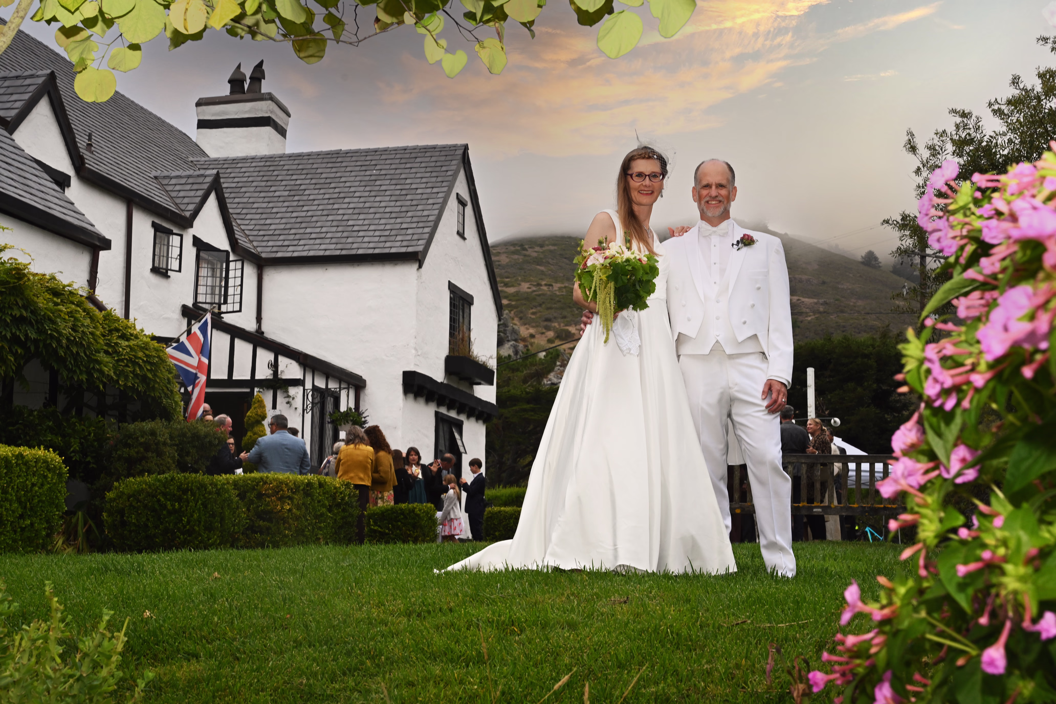 wedding couple, english inn, grass, flowers
